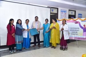 Dr. Ayush Dubey interacting with attendees during a cancer awareness campaign.